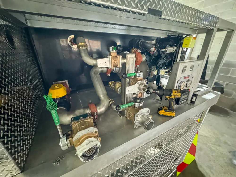 Pump and plumbing components during installation, photo 123 of 303.